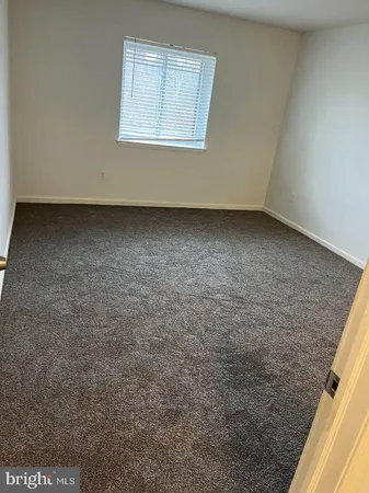 an empty room with a bench