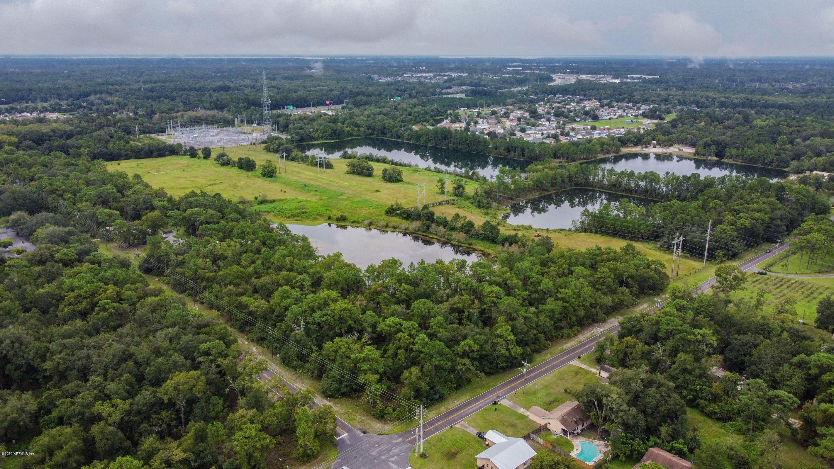 0 Ricker Road Jacksonville, FL 32244 - Photo 11 of 11 an aerial view of residential houses with outdoor space and trees