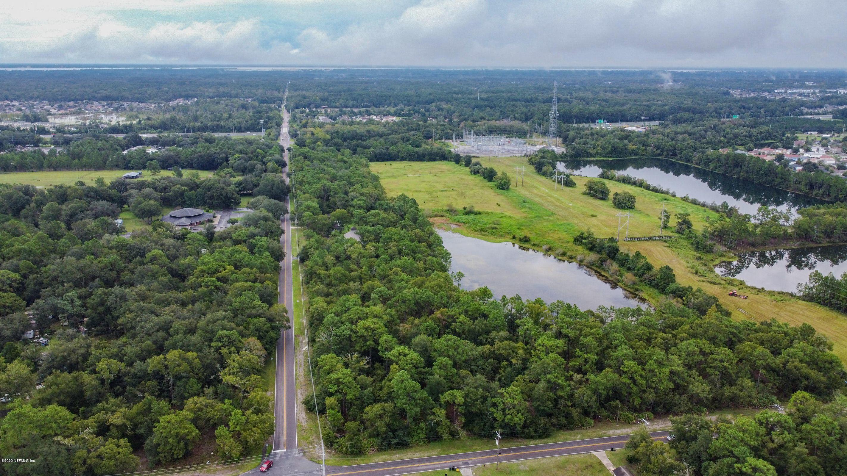 0 Ricker Road Jacksonville, FL 32244 - Photo 2 of 11 an aerial view of residential houses with outdoor space and trees