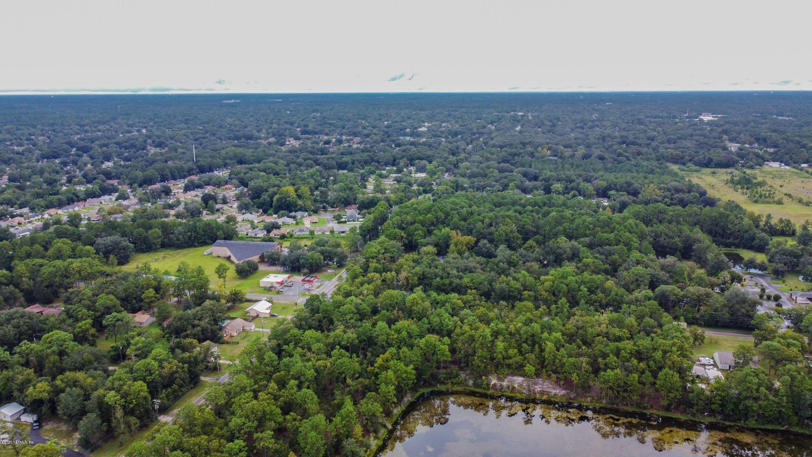 0 Ricker Road Jacksonville, FL 32244 - Photo 7 of 11 a view of a field with an outdoor space