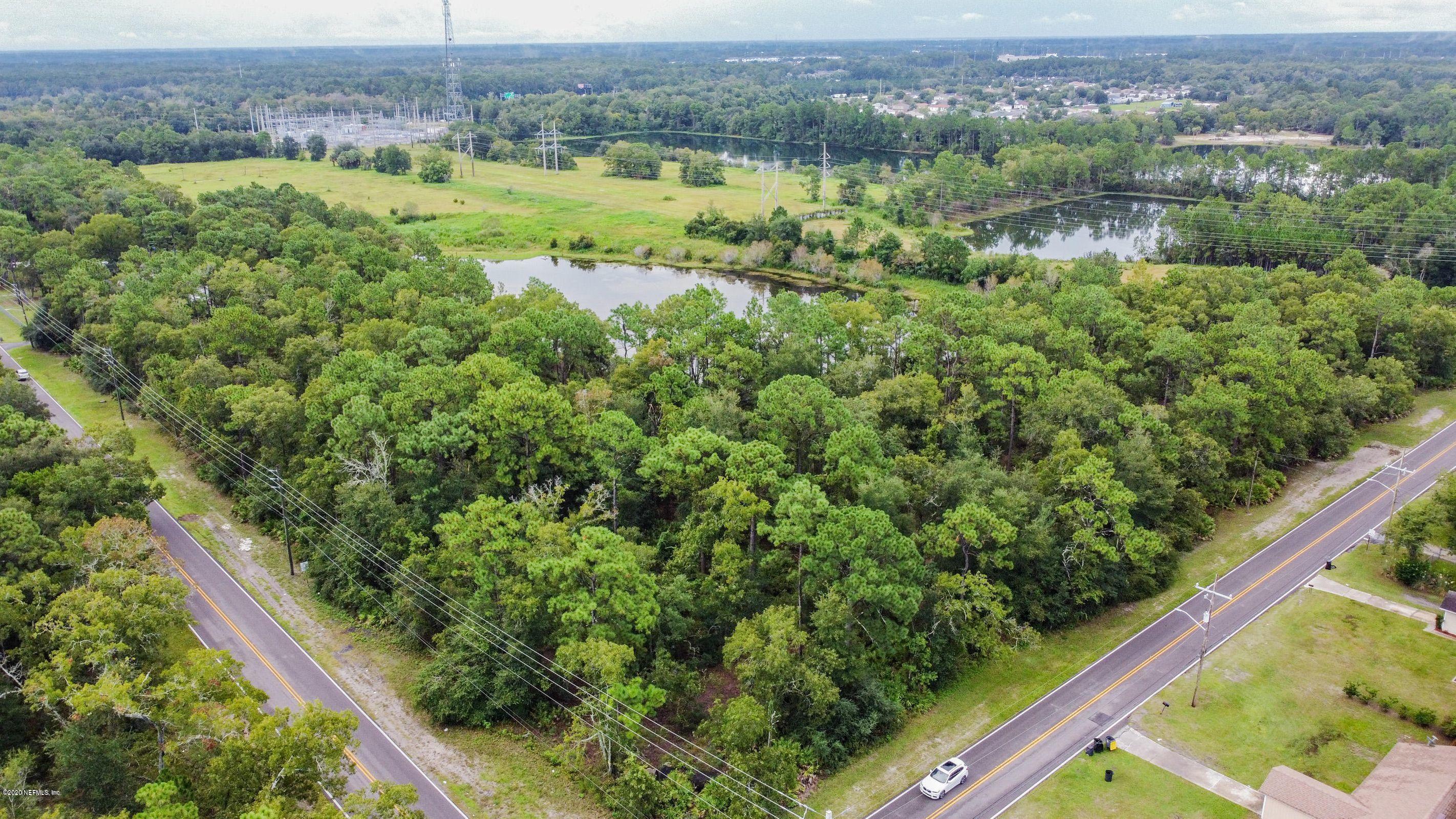 0 Ricker Road Jacksonville, FL 32244 - Photo 10 of 11 an aerial view of residential houses with outdoor space and swimming pool