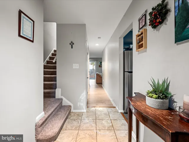 a view of an entryway with wooden floor