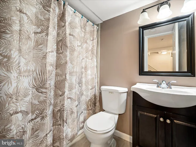 a utility room with closet and windows