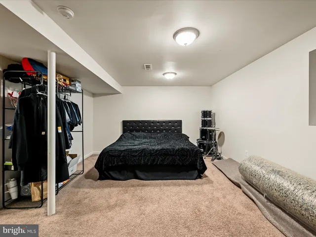 a bed room with a bed and a television