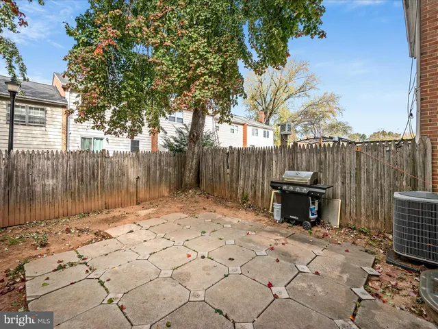 front view of a house with a tree