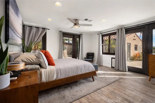 a view of a livingroom with furniture and a ceiling fan