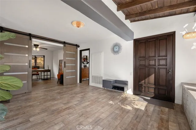 a bathroom with a granite countertop sink a toilet and shower
