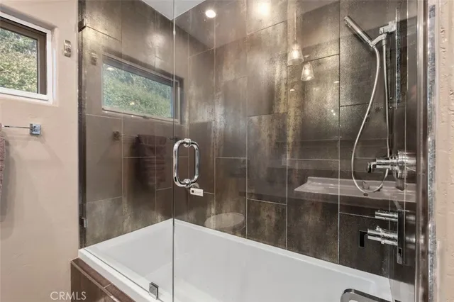 a view of a living room and a floor to ceiling window