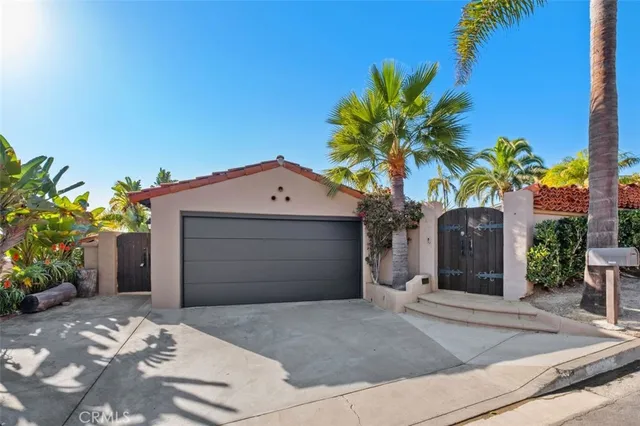 a front view of a house with yard and seating space