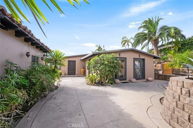 an aerial view of a house with a garden