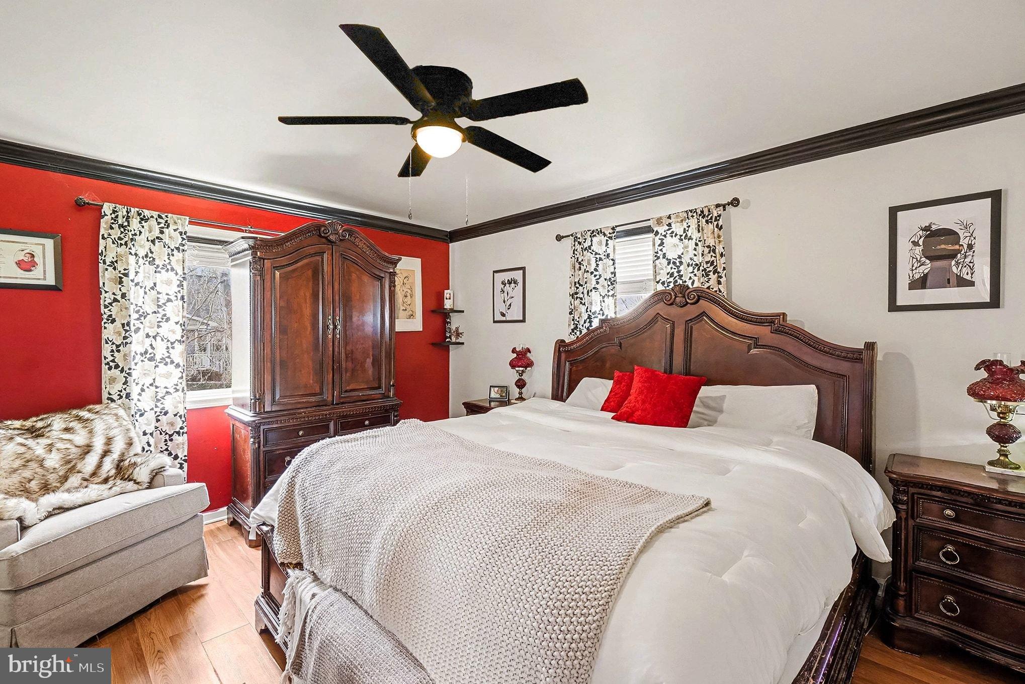 8 Cherry Lane Perryville, MD 21903 - Photo 22 of 57 a bedroom with a bed and a chandelier