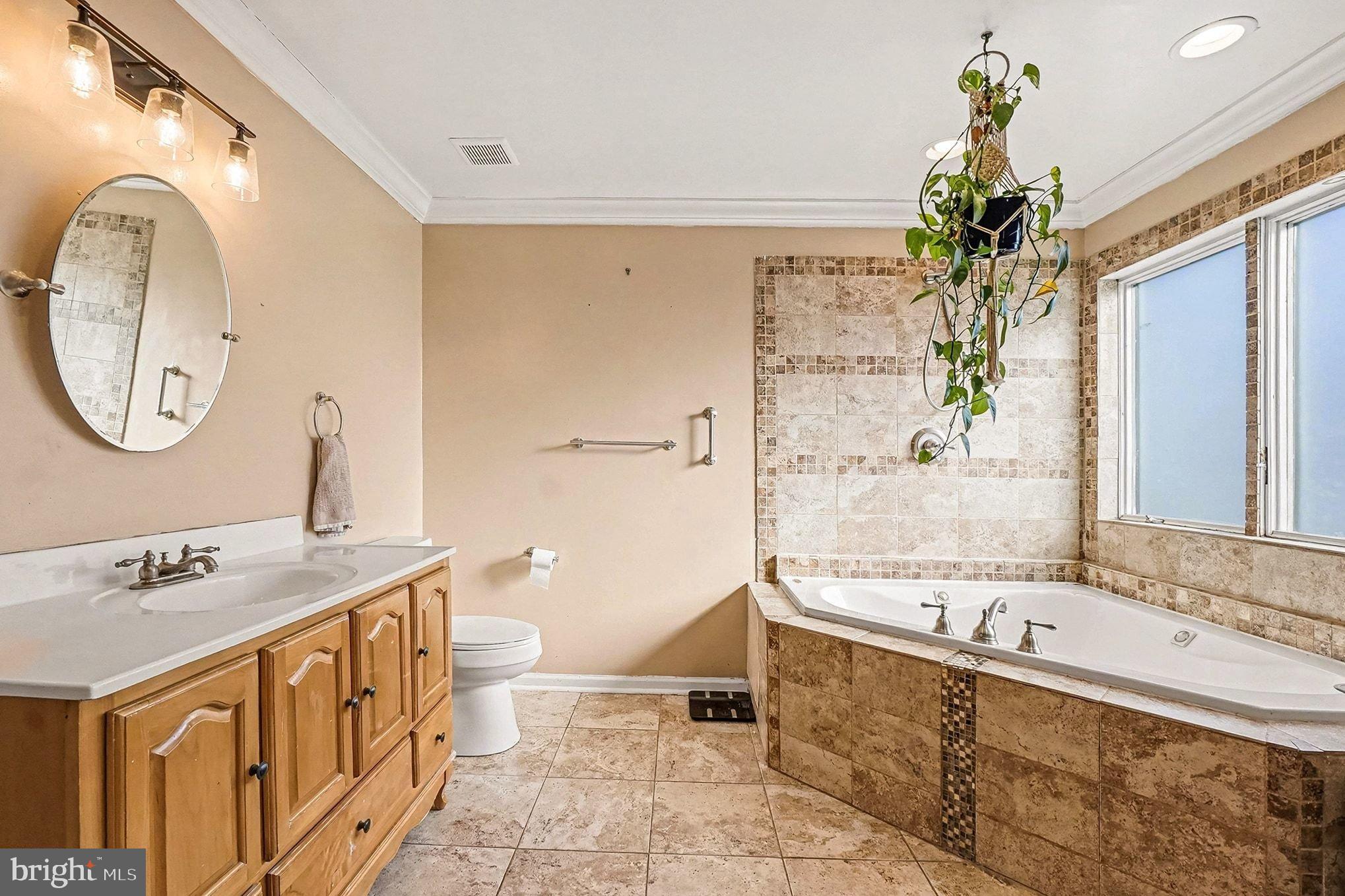 8 Cherry Lane Perryville, MD 21903 - Photo 25 of 57 a bath room with a sink and a mirror
