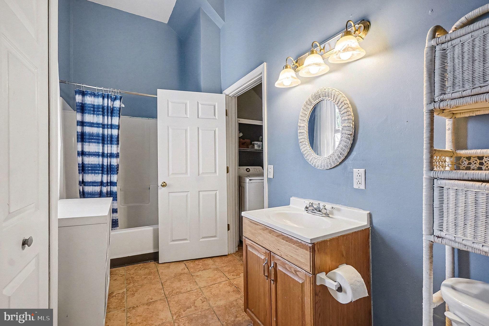 8 Cherry Lane Perryville, MD 21903 - Photo 37 of 57 a bathroom with a sink and a mirror