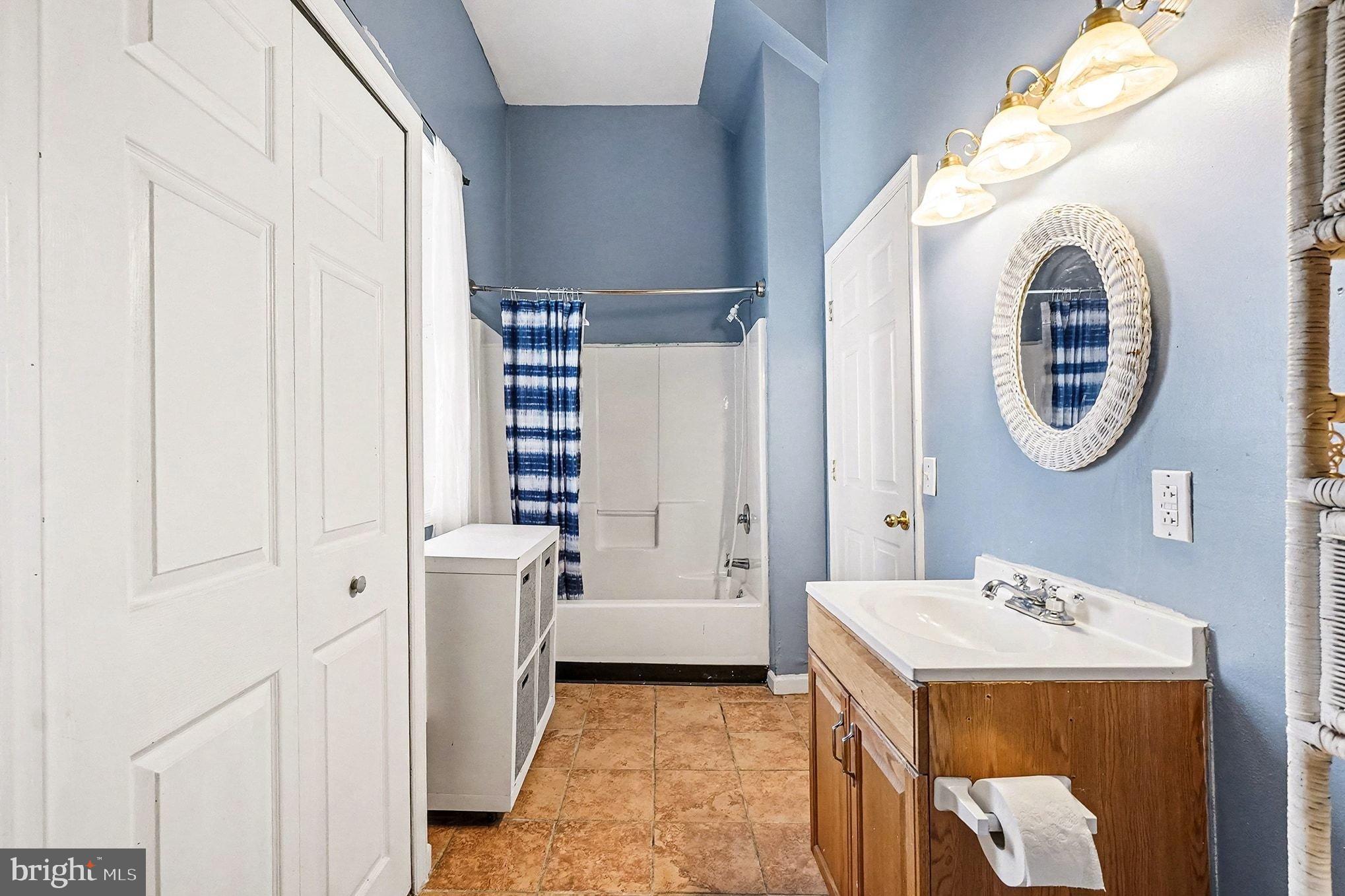 8 Cherry Lane Perryville, MD 21903 - Photo 38 of 57 a bathroom with a sink a mirror and a bathtub