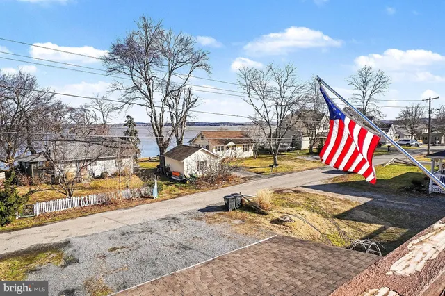 a view of a patio with table and chairs and wooden floor