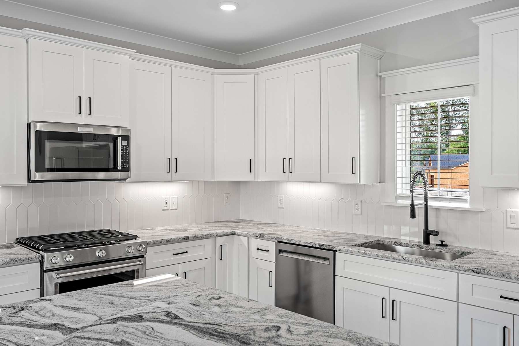 608 Silver Trace White House, TN 37188 - Photo 5 of 19 a kitchen with granite countertop white cabinets and appliances