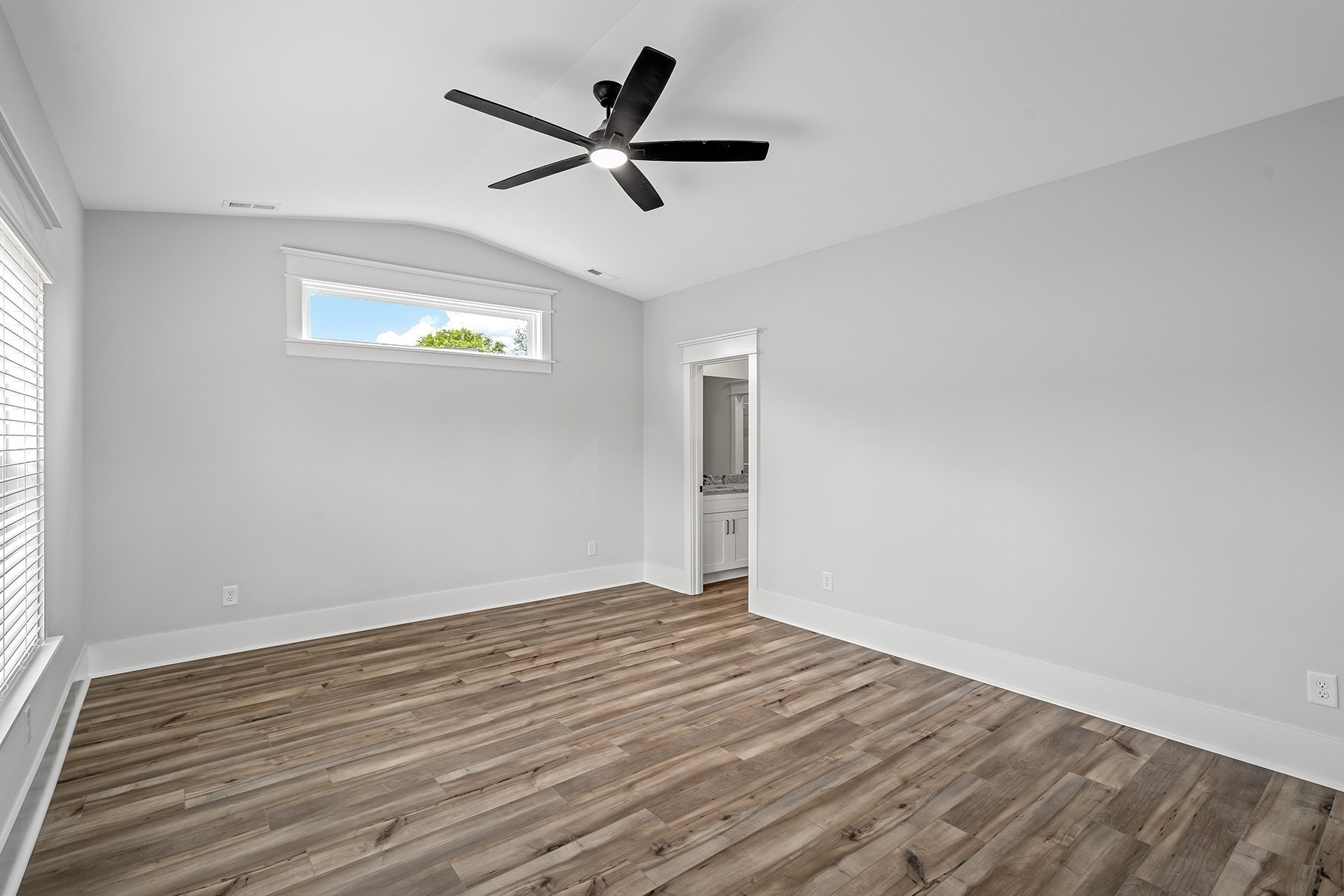 608 Silver Trace White House, TN 37188 - Photo 7 of 19 a view of a big room with wooden floor a ceiling fan and windows