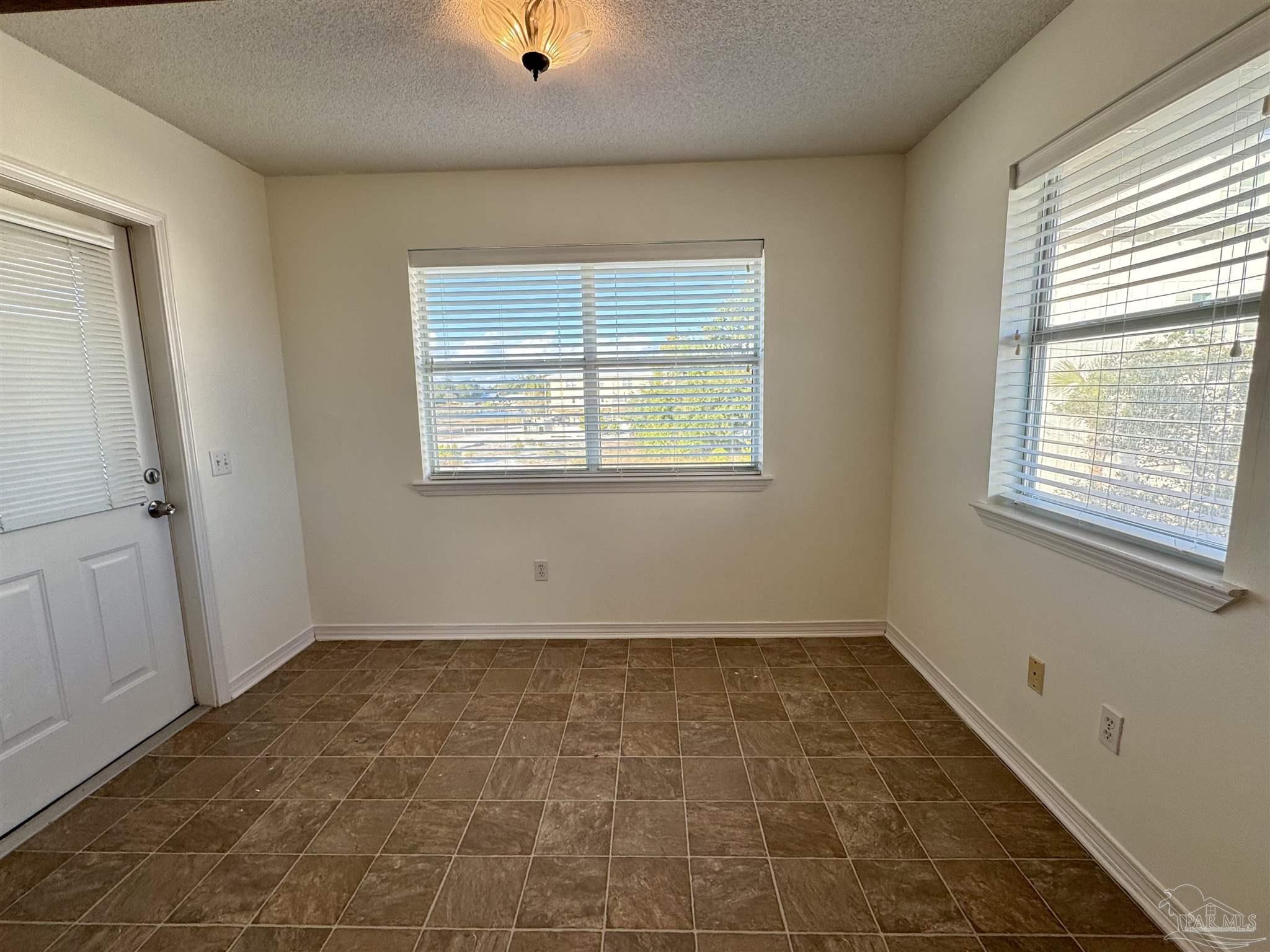 13944 River Road, Unit D Pensacola, FL 32507 - Photo 12 of 14 an empty room with a window