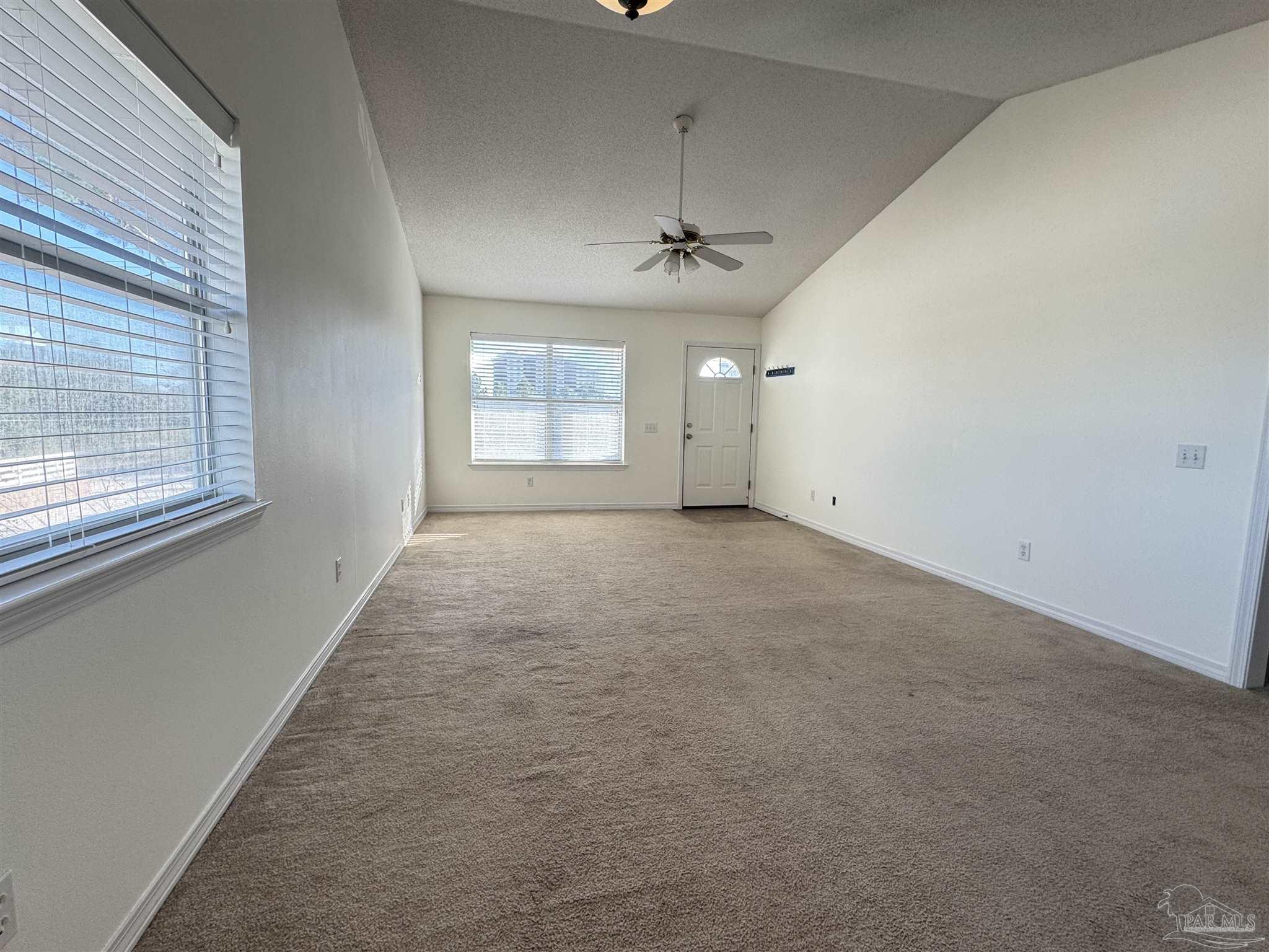 13944 River Road, Unit D Pensacola, FL 32507 - Photo 3 of 14 a view of an empty room with a window