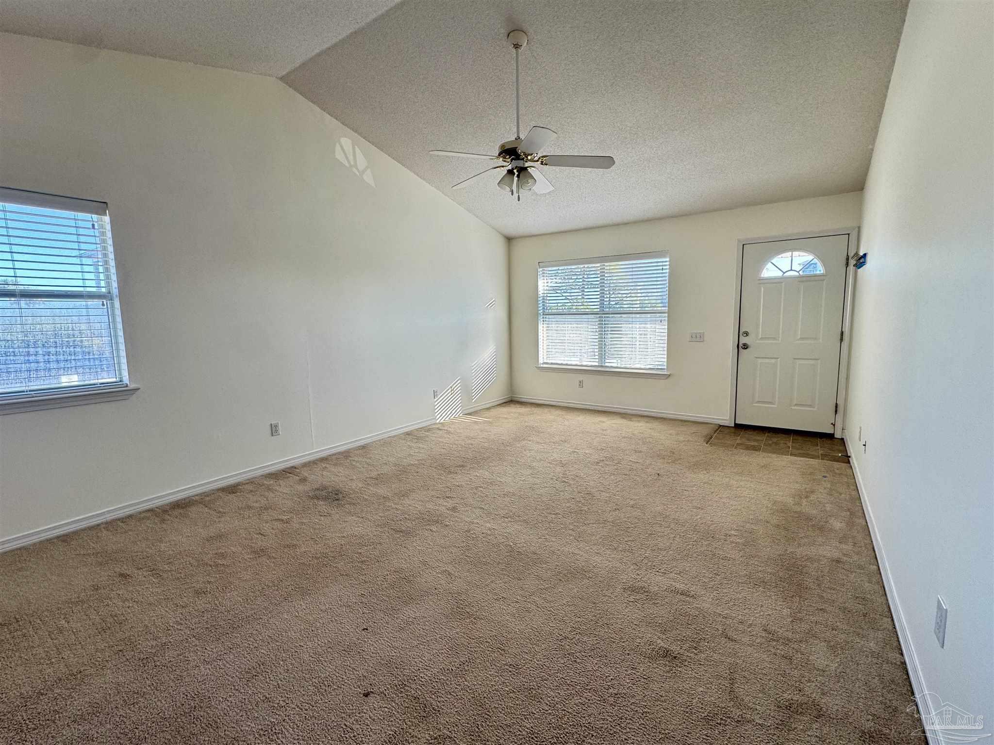 13944 River Road, Unit D Pensacola, FL 32507 - Photo 4 of 14 an empty room with a empty space and windows