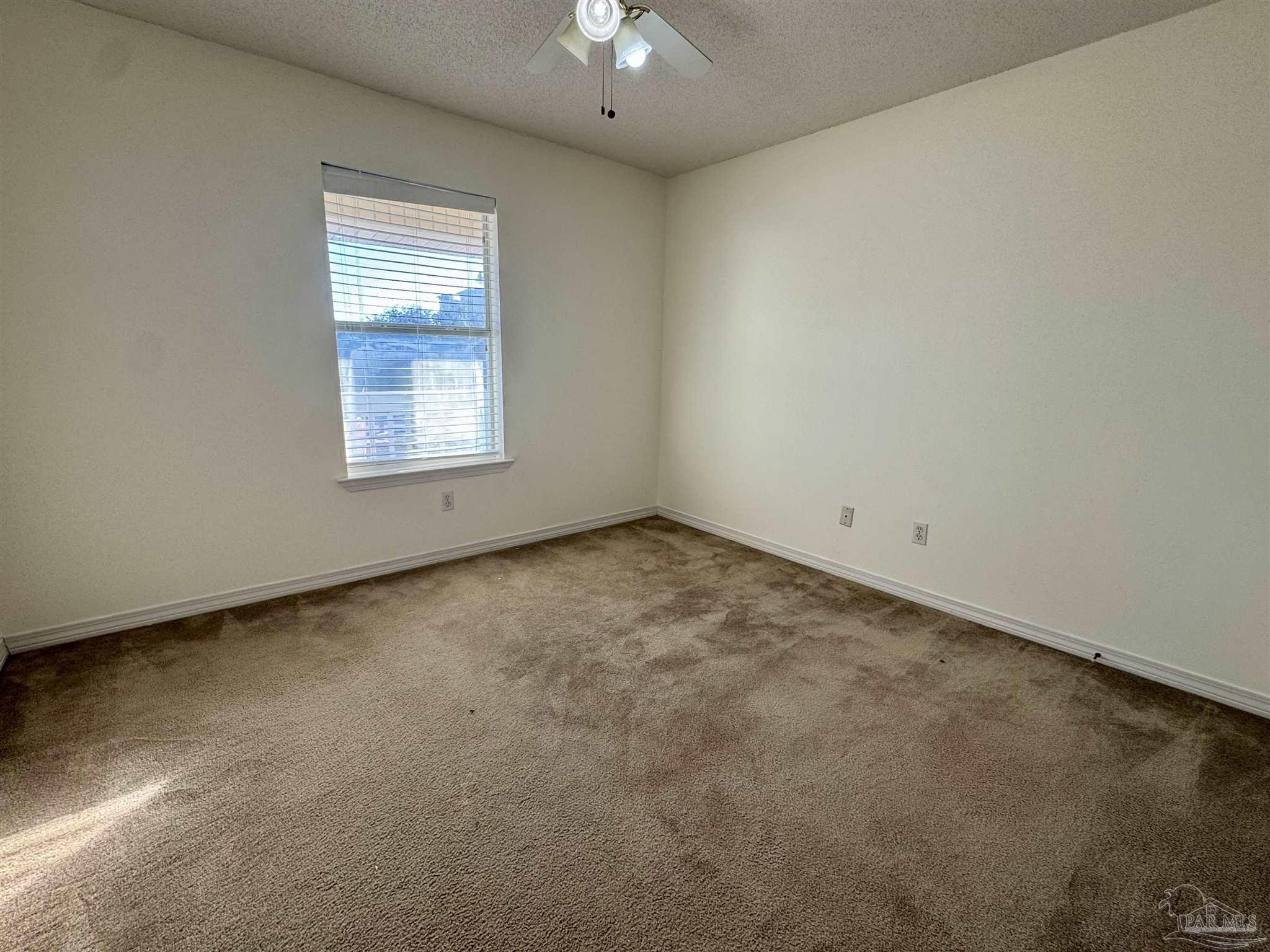 13944 River Road, Unit D Pensacola, FL 32507 - Photo 7 of 14 an empty room with a window