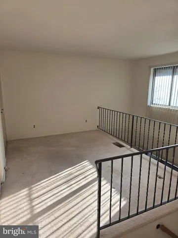 a view of a balcony with wooden floor
