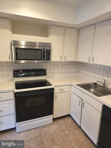 a kitchen with a stove and a microwave