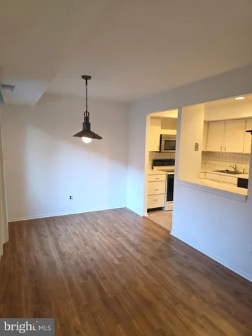 a view of a kitchen with a sink and a stove top oven