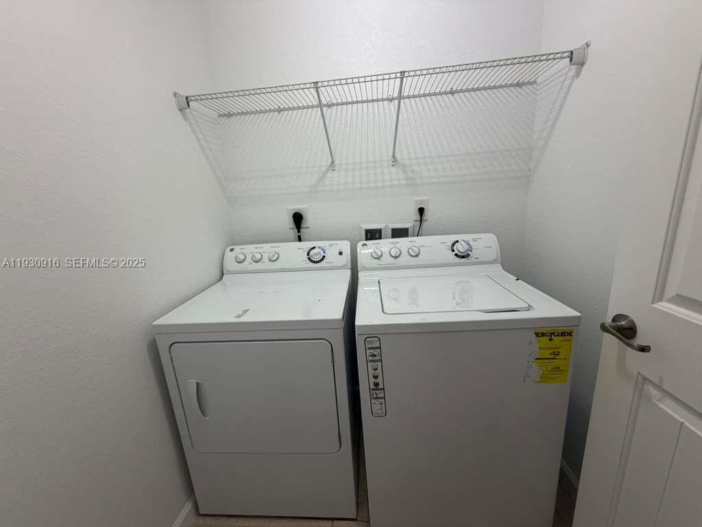 13982 Southwest 276th Street Homestead, FL 33032 - Photo 11 of 15 a utility room with dryer and washer