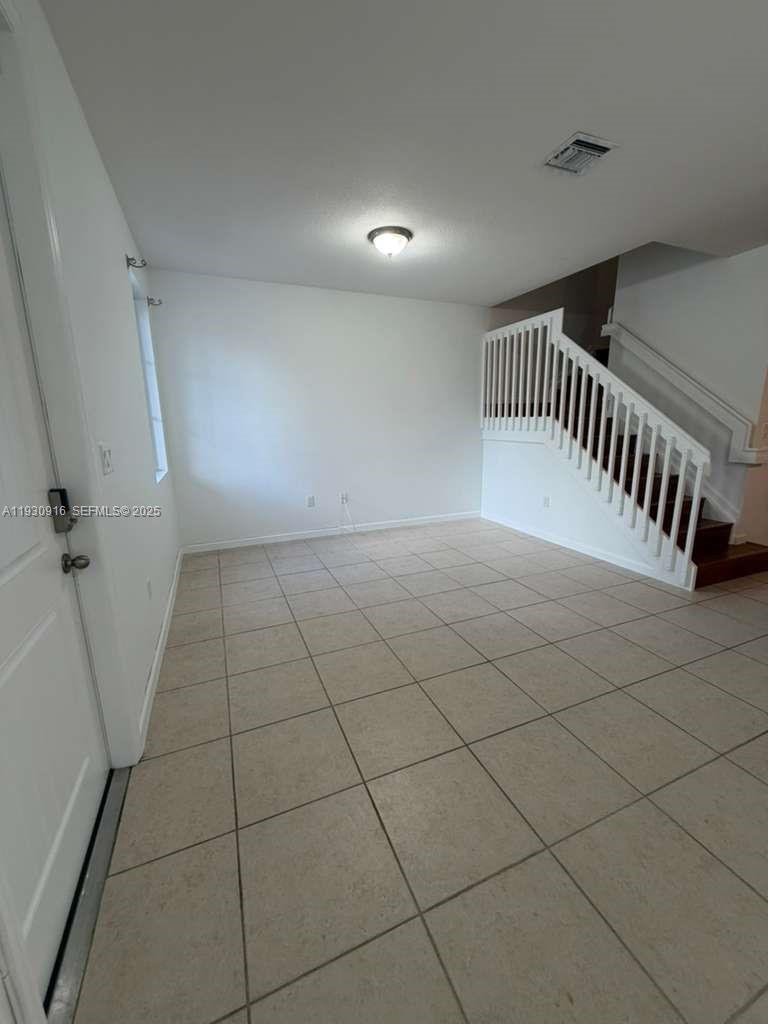 13982 Southwest 276th Street Homestead, FL 33032 - Photo 12 of 15 a view of an empty room and a window