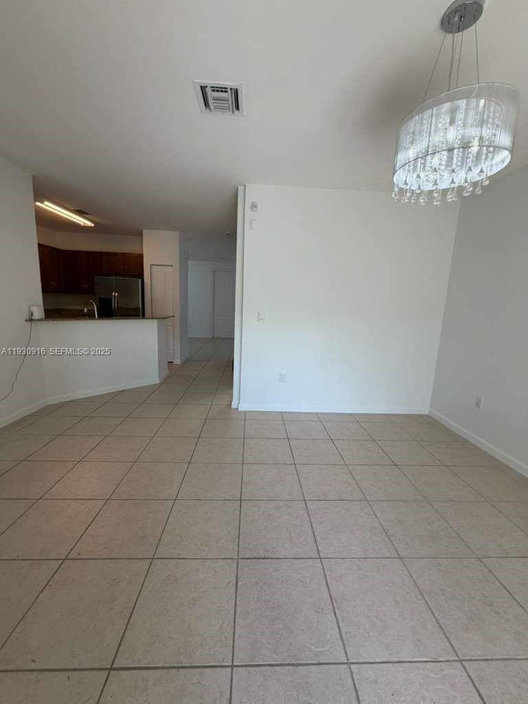 13982 Southwest 276th Street Homestead, FL 33032 - Photo 13 of 15 a view of a livingroom with a kitchen
