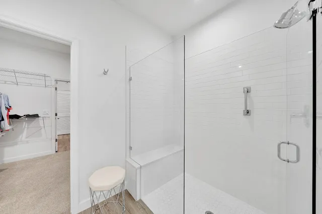 a spacious bathroom with a double vanity sink mirror and toilet