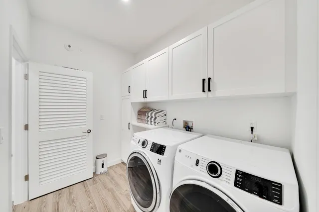 a view of a bathroom with a tub and shower