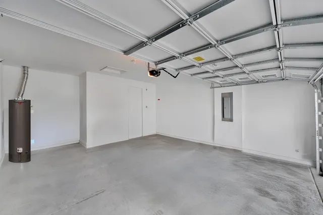 an aerial view of a house with a yard and potted plants