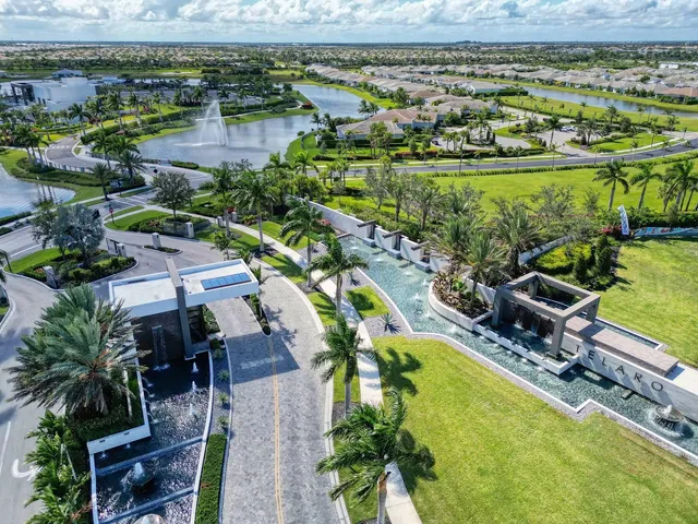 an aerial view of a house with a lake view