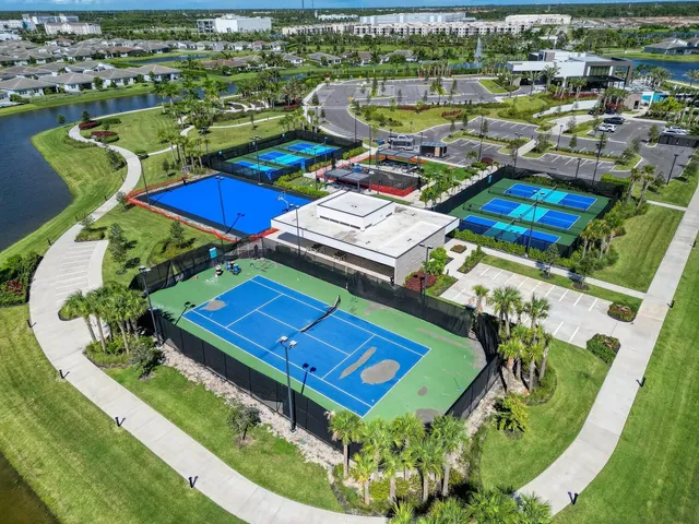 an aerial view of a house with a lake view
