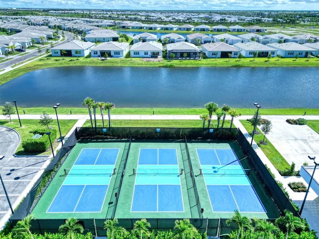 a view of a swimming pool with outdoor seating