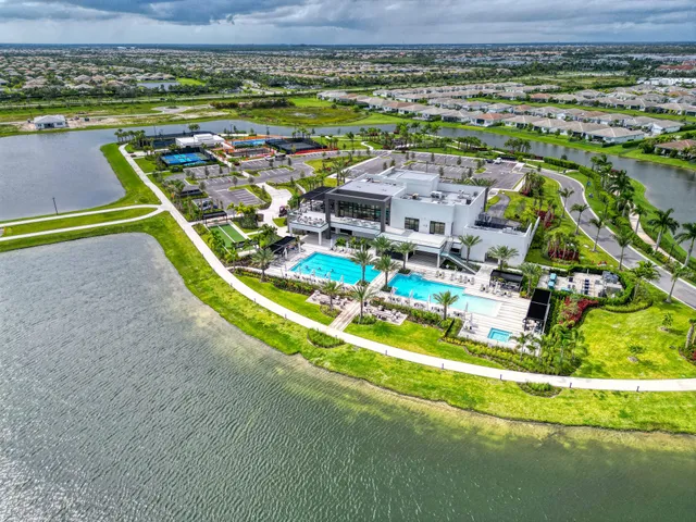 a view of a swimming pool with outdoor seating
