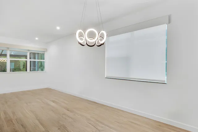 a kitchen with stainless steel appliances a stove a sink and a refrigerator