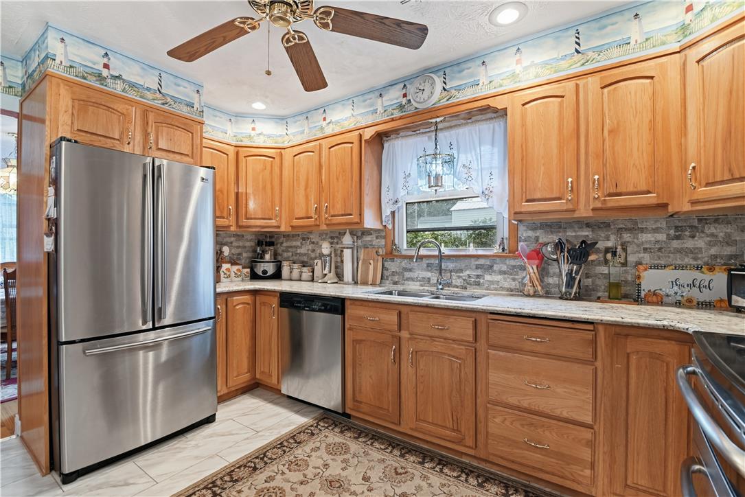 3303 Barklay Road Whitehall, PA 18052 - Photo 10 of 31 A well-equipped kitchen features solid wood cabinetry and sleek stainless steel appliances, perfect for everyday living.