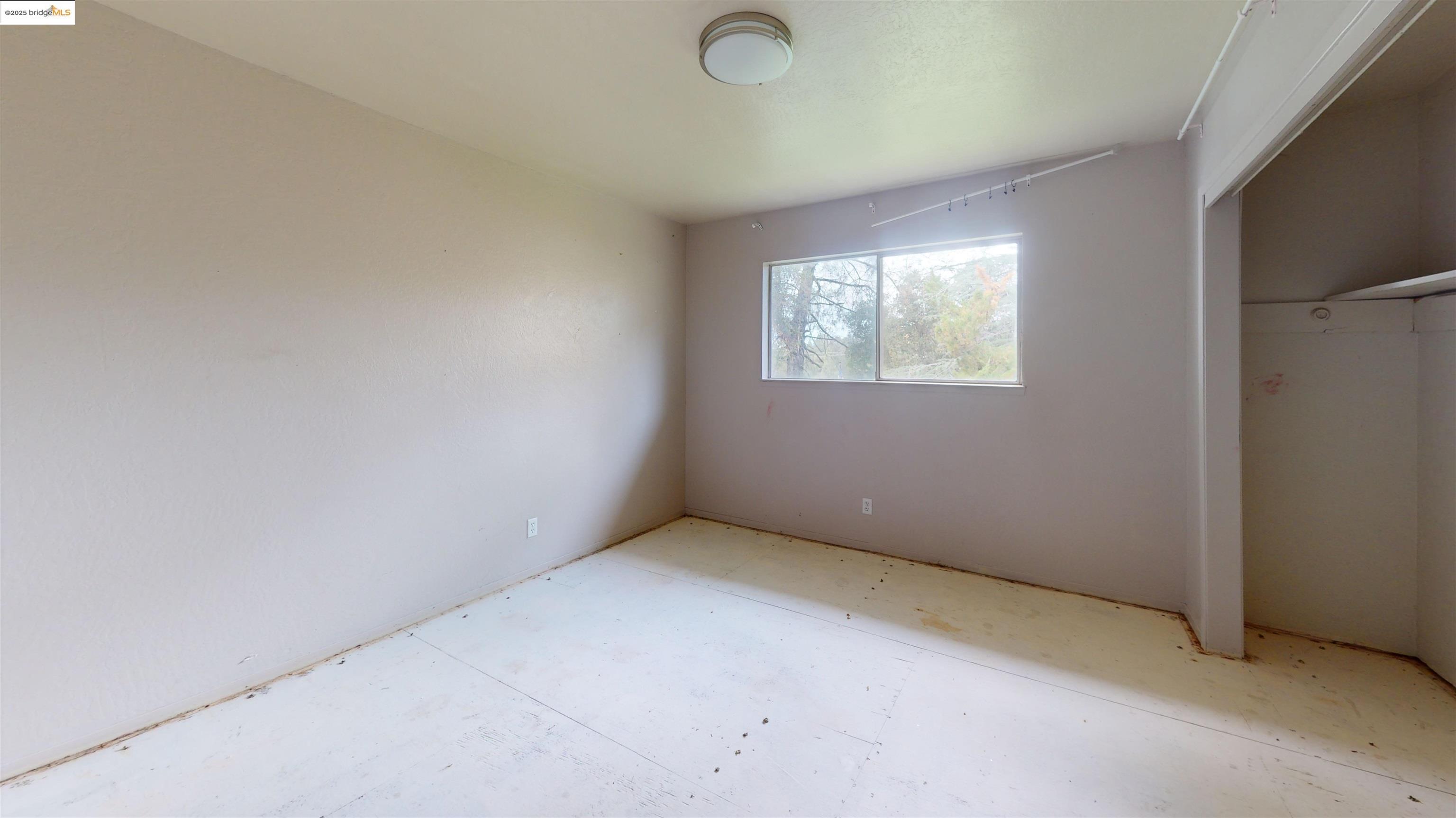 19817 Via Redonda Road Sonora, CA 95370 - Photo 1 of 1 Unfurnished bedroom with a closet