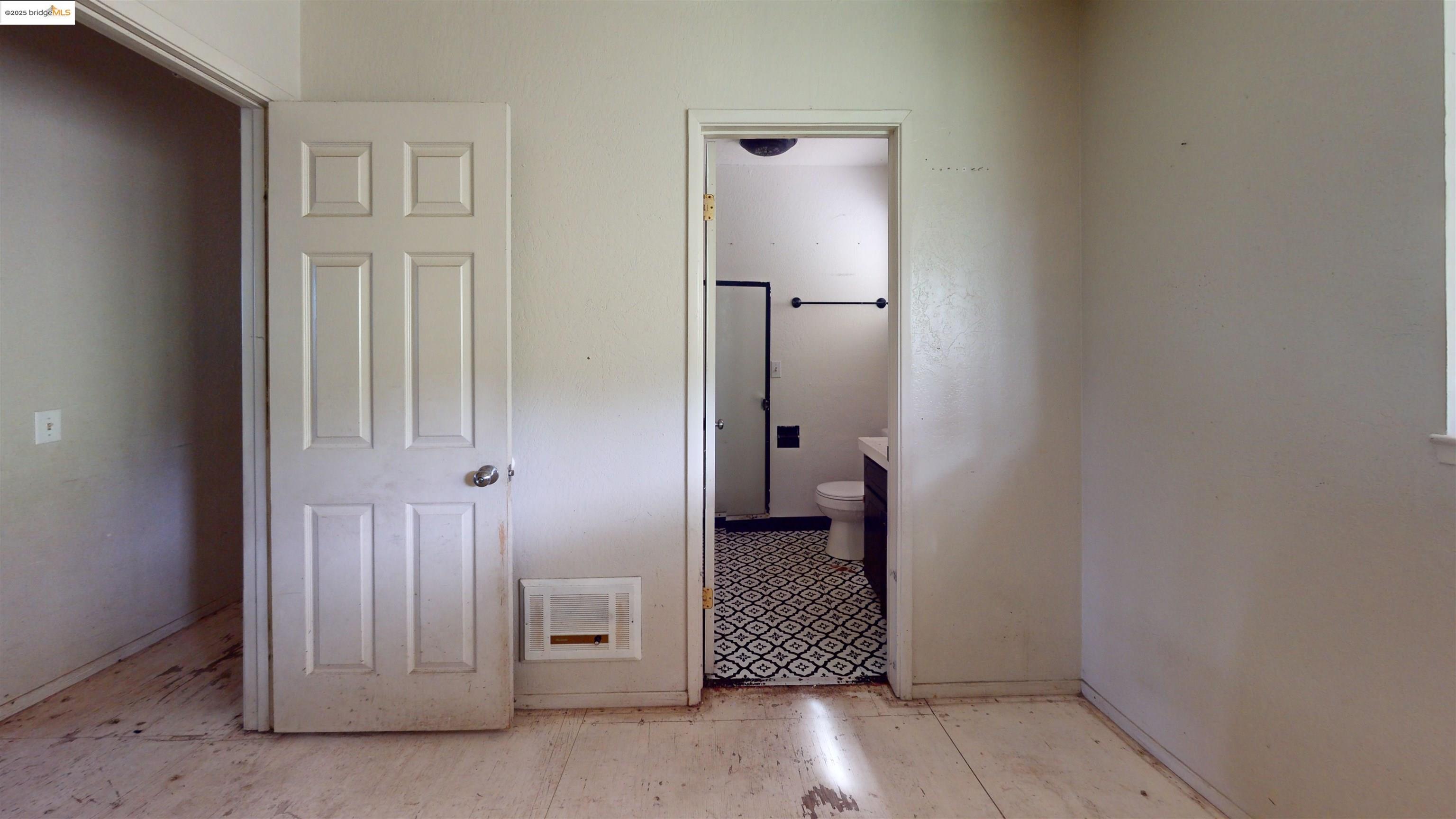 19817 Via Redonda Road Sonora, CA 95370 - Photo 11 of 23 Unfurnished bedroom with ensuite bathroom and heating unit