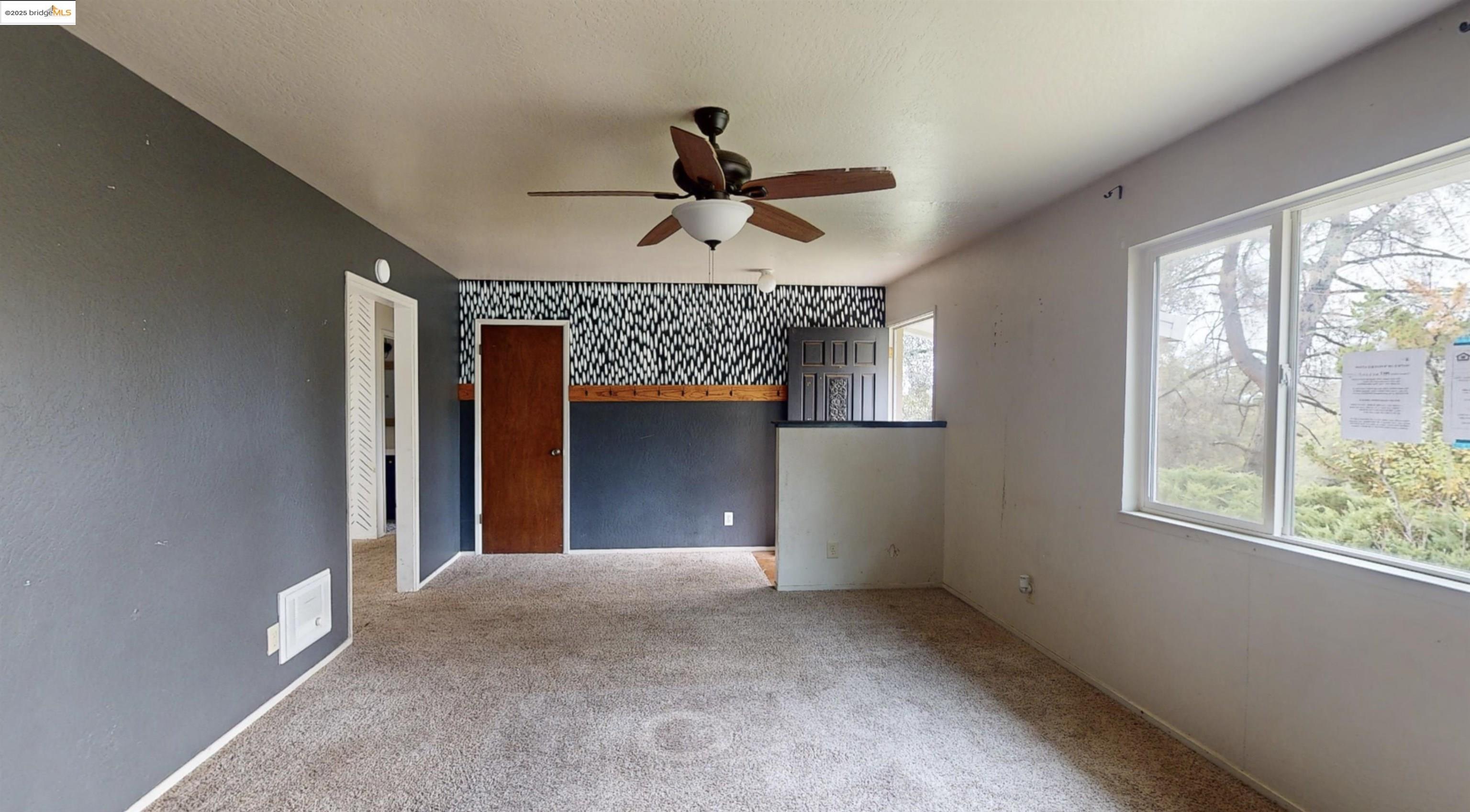 19817 Via Redonda Road Sonora, CA 95370 - Photo 4 of 23 Spare room with carpet floors and ceiling fan