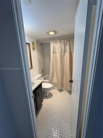 a bathroom with a double vanity sink and mirror