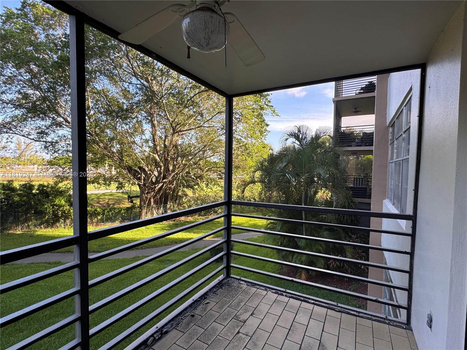1100 St Charles Place, Unit 203 Pembroke Pines, FL 33026 - Photo 18 of 48 a view of a glass door and a window