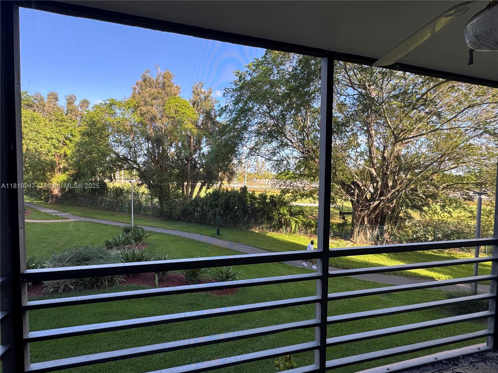 1100 St Charles Place, Unit 203 Pembroke Pines, FL 33026 - Photo 20 of 48 a view of outdoor space with garden