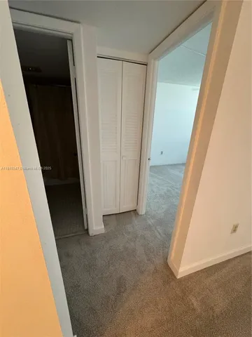 a bedroom with a bed and a mirror