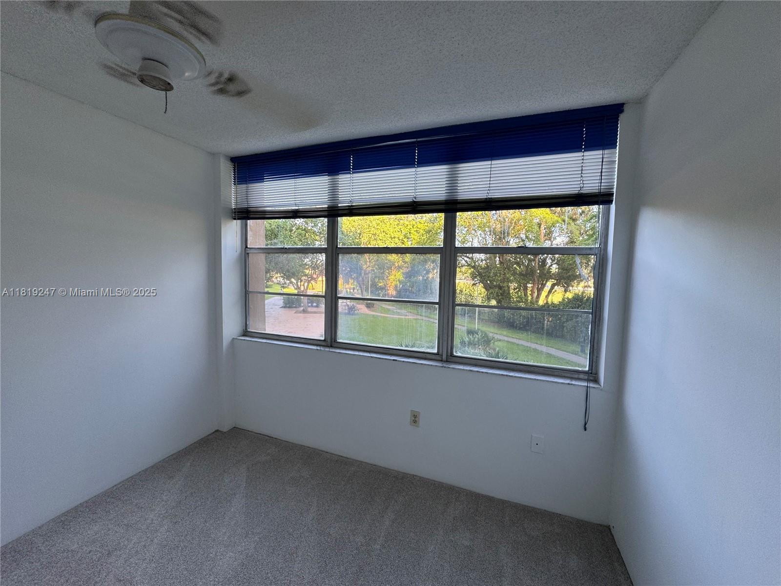 1100 St Charles Place, Unit 203 Pembroke Pines, FL 33026 - Photo 26 of 48 an empty room with a window