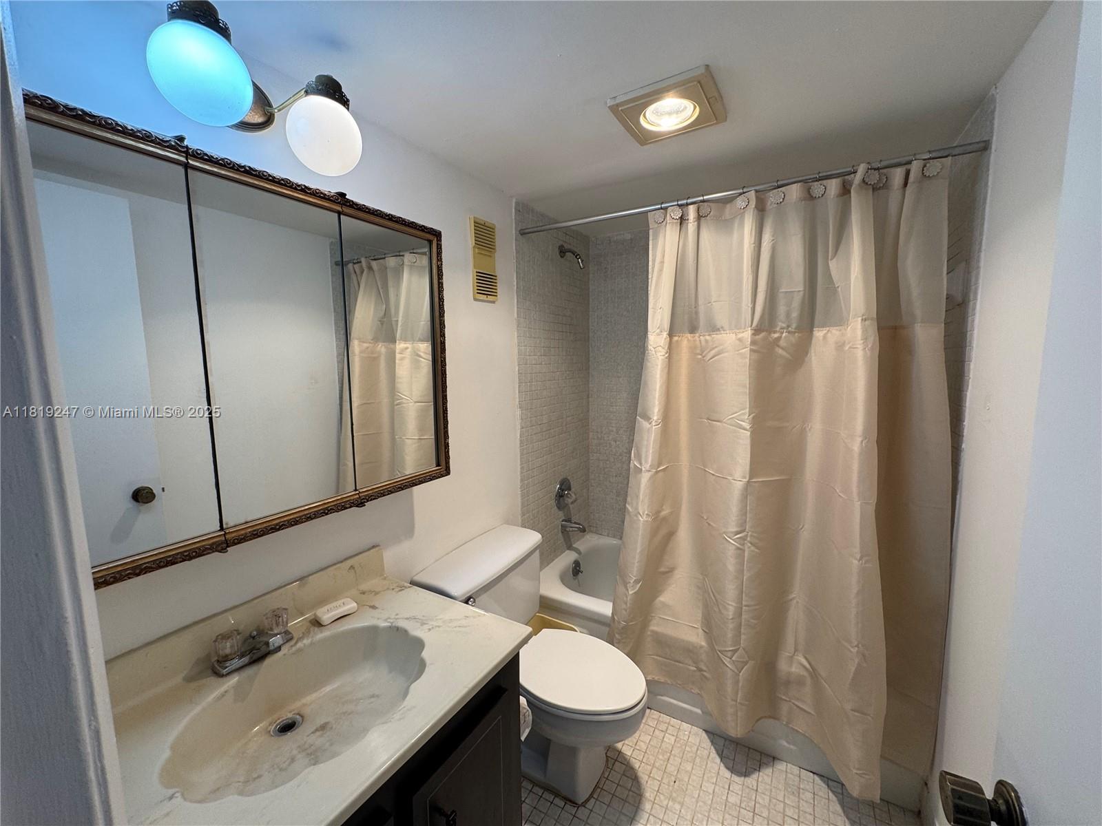 1100 St Charles Place, Unit 203 Pembroke Pines, FL 33026 - Photo 29 of 48 a bathroom with a sink and a mirror
