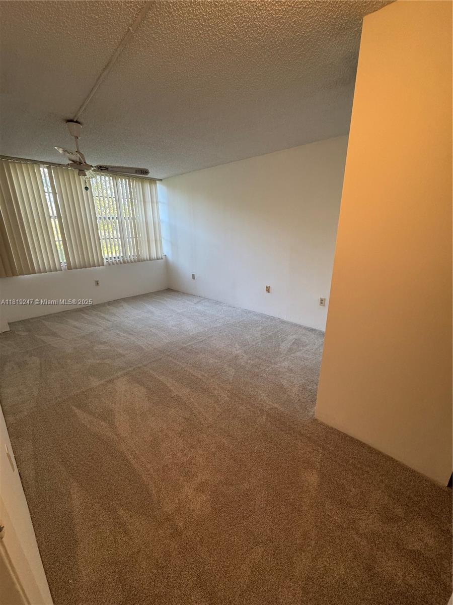 1100 St Charles Place, Unit 203 Pembroke Pines, FL 33026 - Photo 34 of 48 a view of an empty room